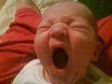 Yawning newborn baby